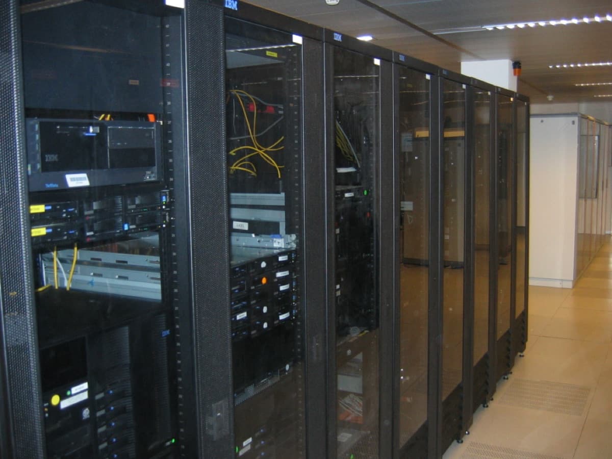 Rows of server racks in a data center, representing the AI-infrastructure market SpaceX positions itself to serve with Starlink and orbital computing