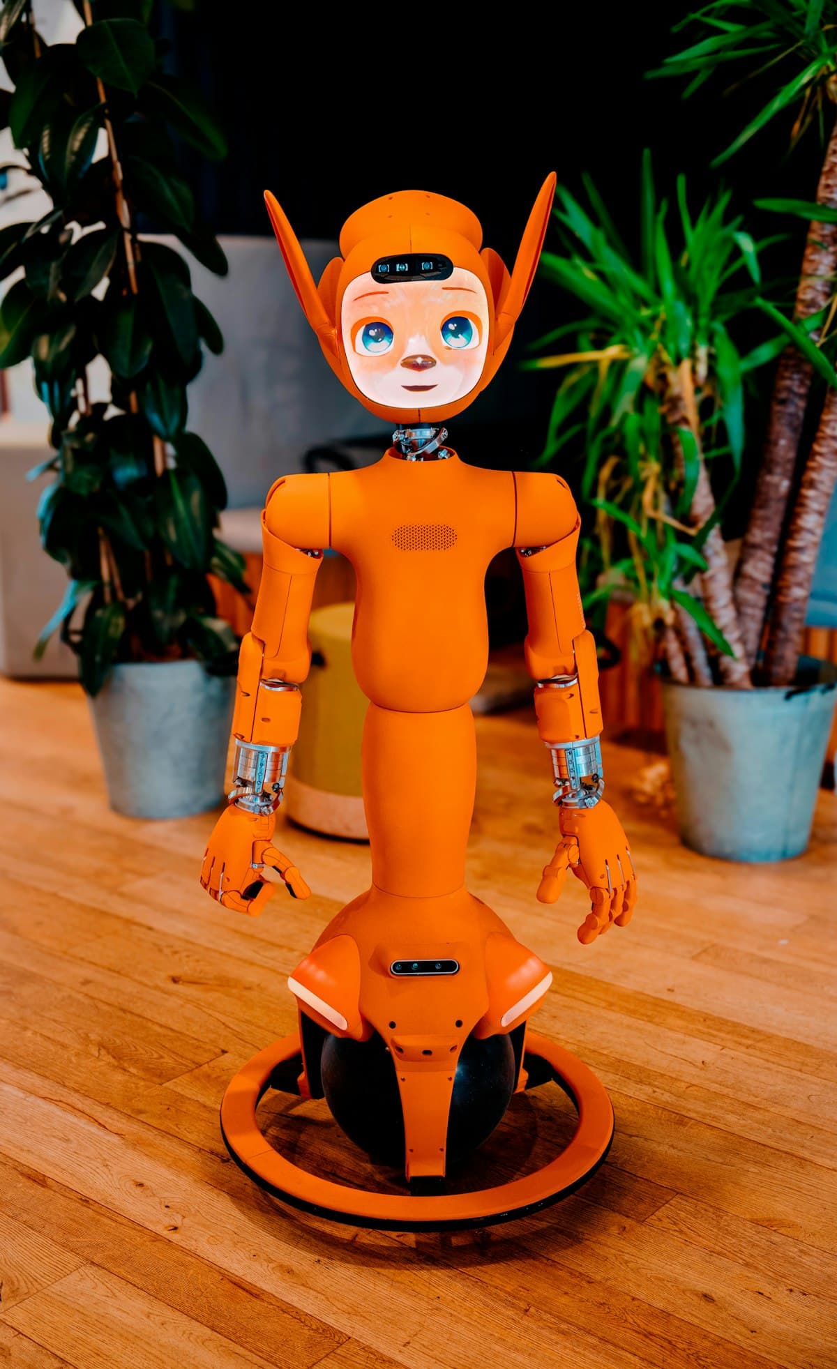 Close-up of a humanoid robot with a digital screen face, representing the perception layer of physical AI systems