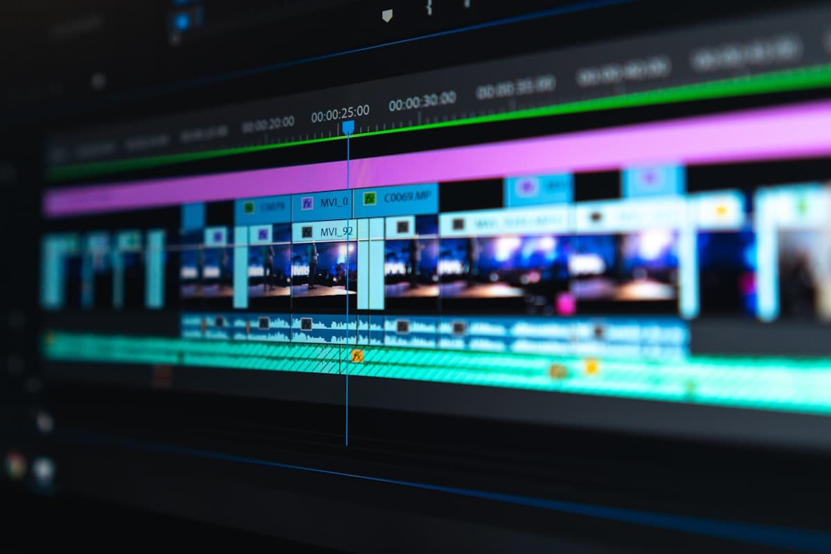 A video editing timeline shown on a monitor, representing the stitching and editing stage of production