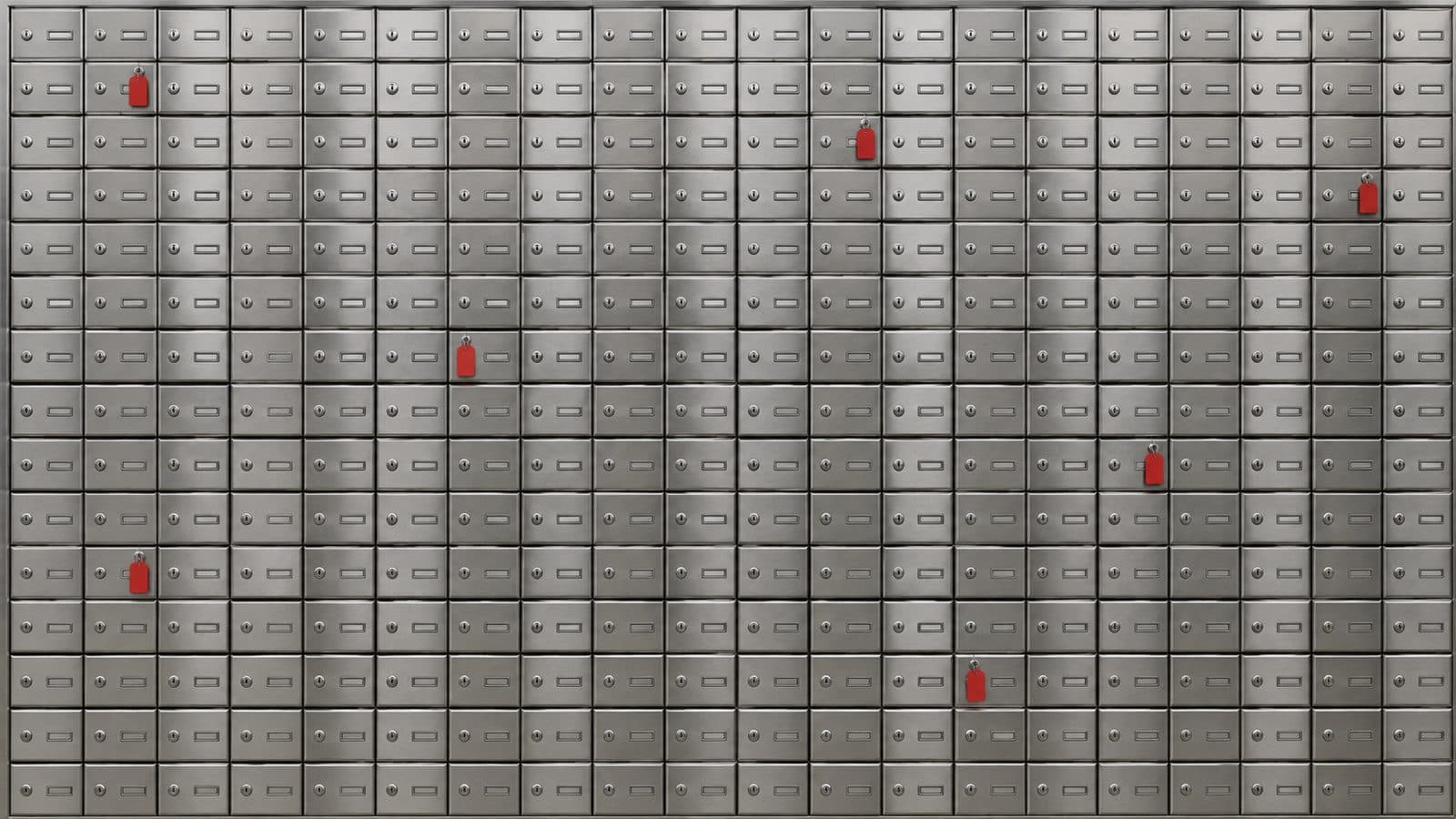 Wall of identical apartment mailboxes with a few doors marked by red tags.